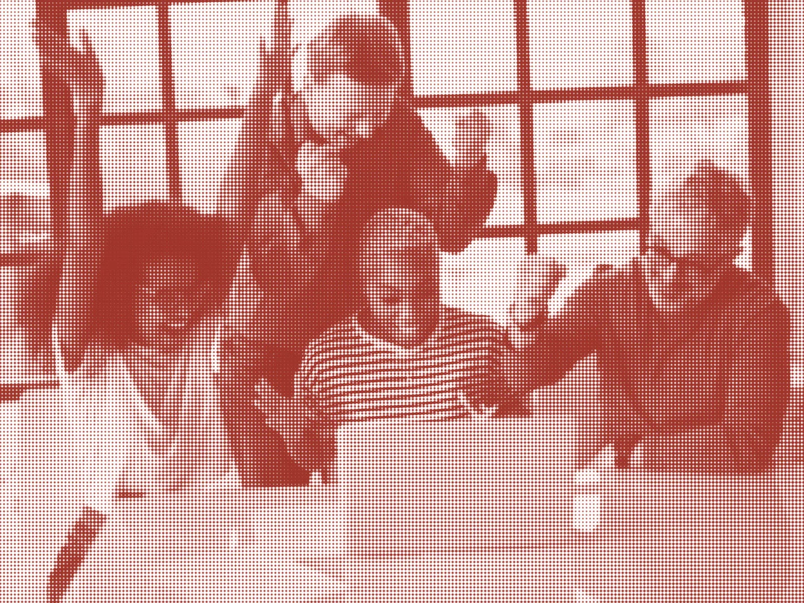 Photo of an excited group of stock photo models, gathered around a laptop and celebrating (presumably) a website launch. Photo has a half-tone effect and red colour overlay applied.